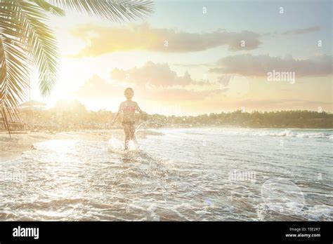 Happy Child Girl Having Fun On Sea Beach Stock Photo Alamy