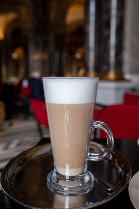 Glass Cup Of Coffee Latte Served In Classic Old Austrian Café