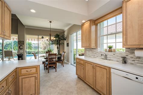 But for the large door i am not sure where to place the handle. The kitchen has light oak cabinets, a tile backsplash, recessed lighting, under cabinet ligh ...