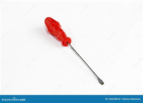 Old Rusty Metal Screwdriver For Screws With Red Handle Stock Photo