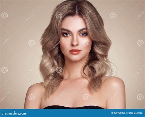 A Beautiful Young Woman With Shiny Wavy Blonde Hair Stock Image Image