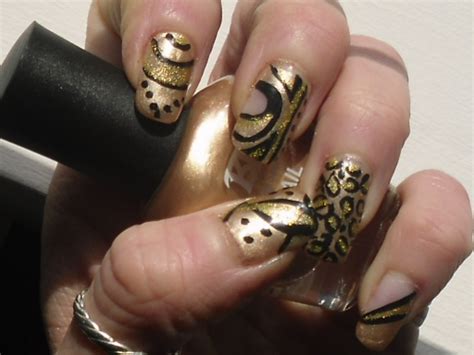 Fashionable and beautiful manicure design, unusual and stylish ideas in nail art, technologies for their implementation. Black And Gold Nail Designs - Pccala