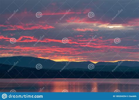 A Red Sunset Over Mcleod Lake At Whiskers Point Provincial Park