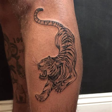 10 Best Crouching Tiger Tattoo Designs PetPress Tiger Tattoo