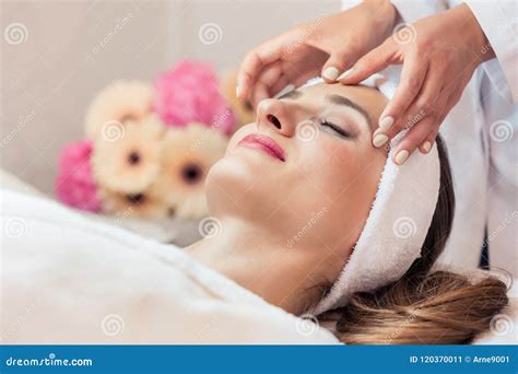 Beautiful Woman Relaxing During Rejuvenating Facial Massage Stock Image Image Of Female