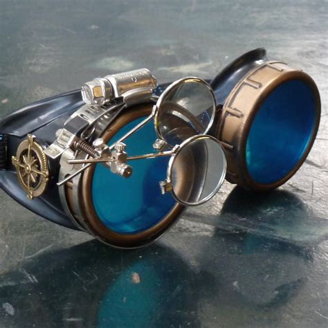 Black And Bronze Steampunk Goggles With Blue Lenses And Eye Loupe