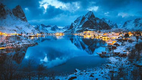Reine Village With Olstinden Peak In Winter Evening Lofoten Islands