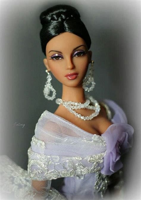 A Barbie Doll Wearing A White Dress And Pearls