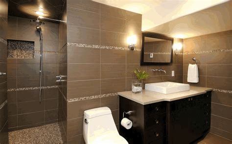 Marble tile looks extra glam when paired with gold accents and light fixtures. To da loos: Shower and tub tile design layout ideas