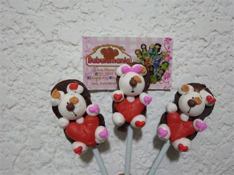 Three Teddy Bear Lollipops In The Shape Of Bears With Hearts On Them