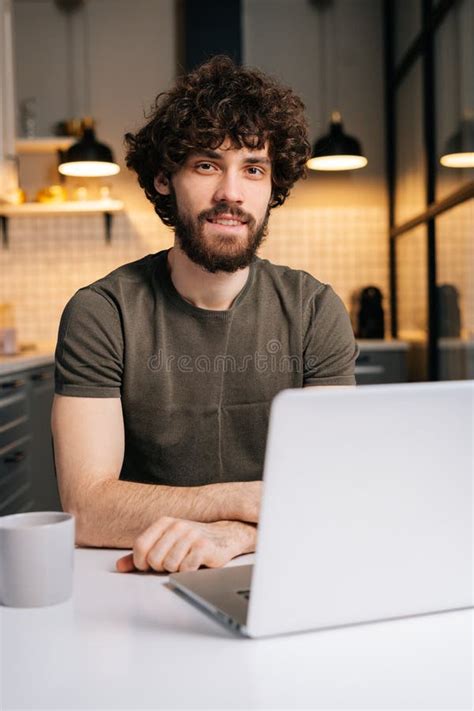 Vertical Portrait Of Happy Bearded Young Business Man Using Typing On