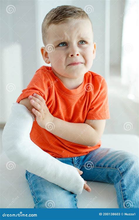 Little Boy In A Castchild With A Broken Arm Funny Kid After Accident