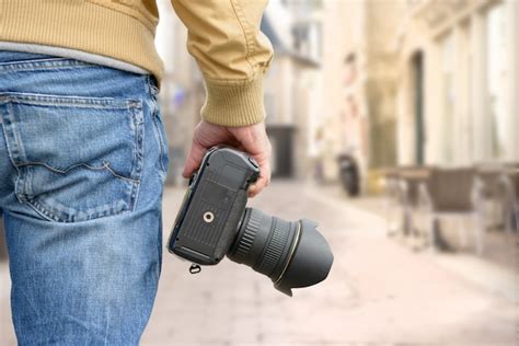 Premium Photo Photographer Holding His Photo Camera