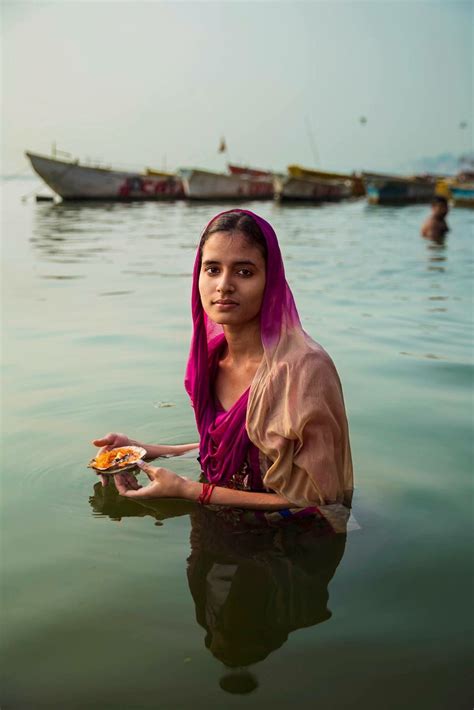 hindu pilgrim making an offering on the ganges river a few weeks ago in varanasi india the