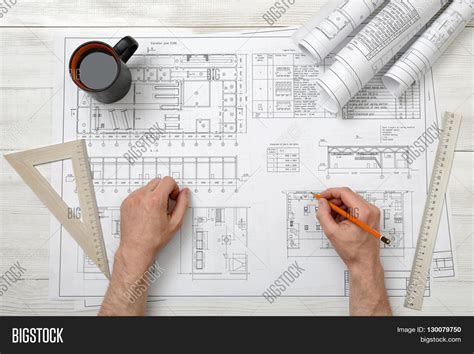 Close Up Hands Of Architect Working With Pencil On A