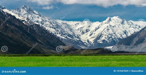 Mountain Ranges And Green Grass Field Landscape Stock Image Image Of