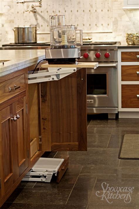 I also have a small drawer in the lower cabinet and i store parchment paper and foil (which are handy next to the oven). Under counter step stool disappears with toe kick and pop ...