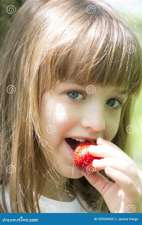 Little Beautiful Girl Eats A Juicy Fresh Strawberries Stock Image Image Of Female Health