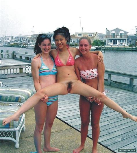 Two Friends Holding Up A Naked One Amateur Teen