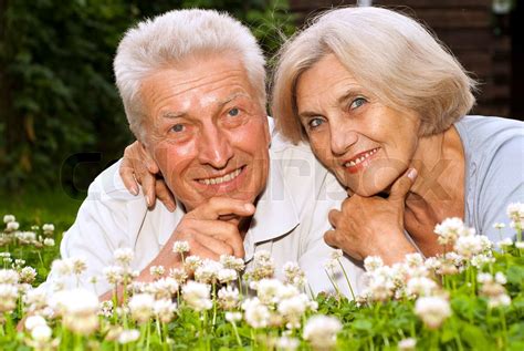 Adorable Old Couple In The Middle Of The Lawn Stock Image Colourbox