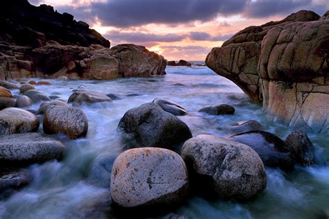 Time Lapse Photography Of Body Of Water With Rocks During Daytime Hd