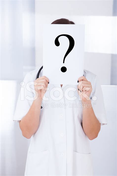 Doctor Holding Question Mark Sign In Hospital Stock Photo Royalty