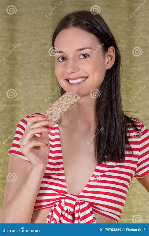 Country Girl Wearing A Knotted Crop Top West And Jeans Hot Pants Is Smiling While She Touches