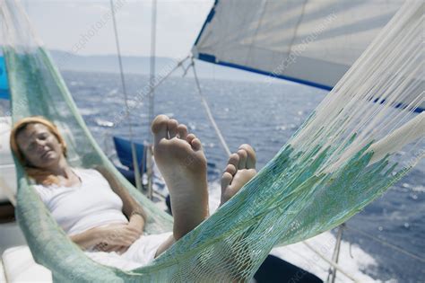Woman Lying In Hammock On Sailing Boat Stock Image F0037410 Science Photo Library