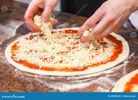 Pizza Base On The Working Electric Oven Royalty Free Stock Image