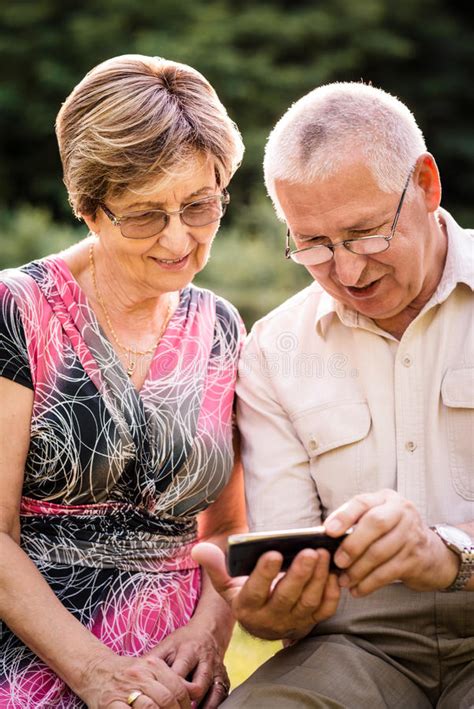 Senior Couple With Smartphone Stock Image Image Of Couple Sitting 44303103