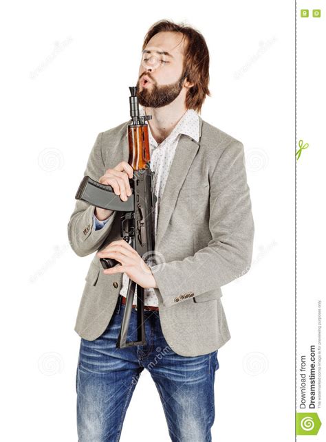 Man Holding A Machine Gun Isolated On White Background Stock Photo