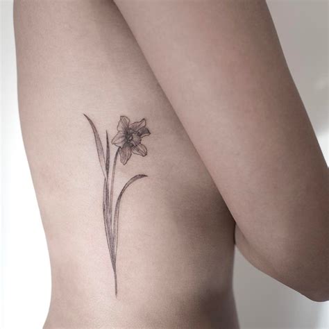 Tattoo Symbols And What They Mean Daffodil Tattoo Friend Tattoos