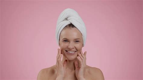 Happy Middle Aged Woman Making Skin Lifting Facial Massage After Shower