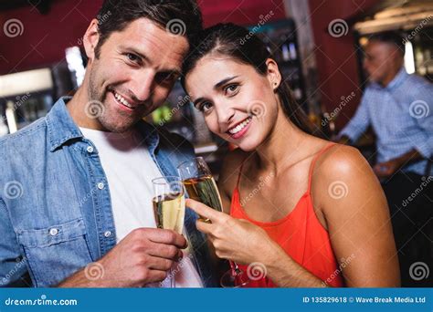 Couple Enjoying Champagne In Nightclub Stock Photo Image Of Closeup