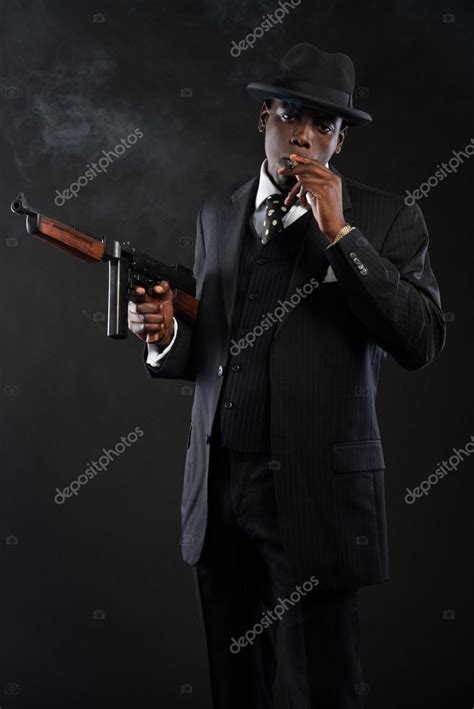 Retro African American Mafia Man Wearing Striped Suit And Tie An Stock