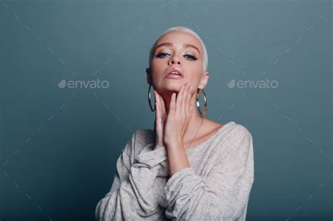 Millenial Young Woman With Short Blonde Hair Portrait Doing Face Yoga Self Facebuilding Massage