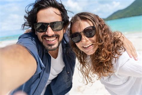 Beach Vacation Couple Taking Selfie Photograph Using Smartphone Stock