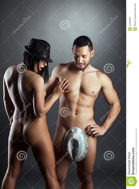 Surprised Nude Woman Looking At Man Dressed In Hat Stock