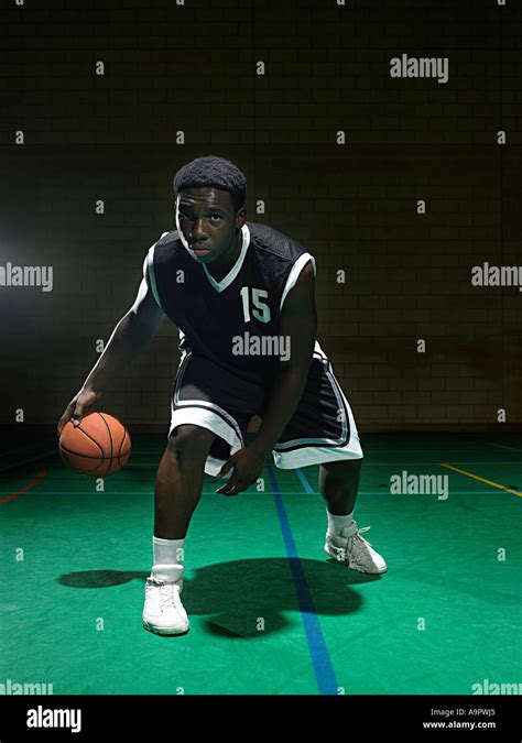Basketball Player Dribbling The Ball Stock Photo Alamy
