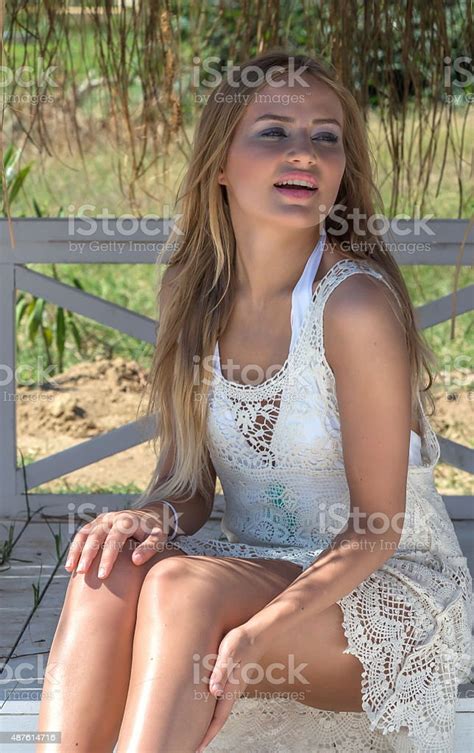Beautiful Girl Sitting Stock Photo Download Image Now Applying