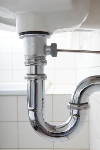 Having cleaned up from leaky pipes under the kitchen sink about once a month in the past year, i understood immediately why she was not thrilled this column idea had suddenly come to her. Sink Pipe Under Wash Basin Stock Photo - Download Image ...