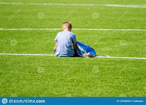 Sad Alone Boy With Backpack Sitting Stadium Outdoors Stock Image