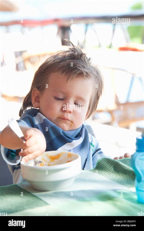 Baby Boy Eating Stock Photo Alamy