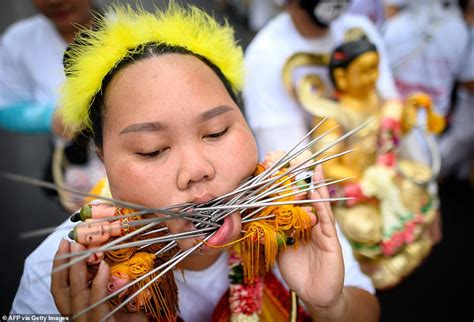 Gruesome Images Show Thai Devotees Impale Their Cheeks Daily Mail Online