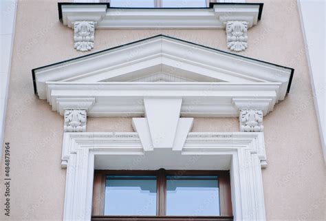 The Upper Part Of The Window Of The Neoclassicism Style With A Complex
