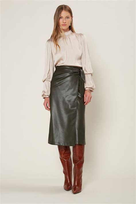 this faux leather midi skirt flatters with wrap styling that ties up at the side a foolproof