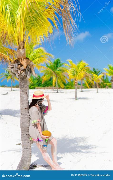 Young Beautiful Woman On Tropical Beach With Palmtrees Stock Image
