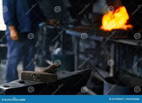 Close Up Of Blacksmith Heating Metal Piece At Forge Stock Image Image