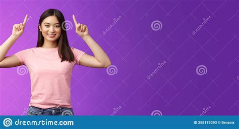 Cute Assertive Dark Haired Asian Woman Wear Pink T Shirt Raise Hands Up