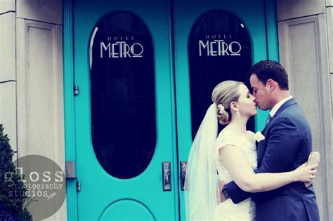 A Bride And Groom Standing In Front Of A Blue Door With The Words Merlo
